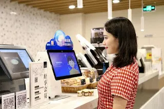 顔認証決済端末を使う消費者のイメージ